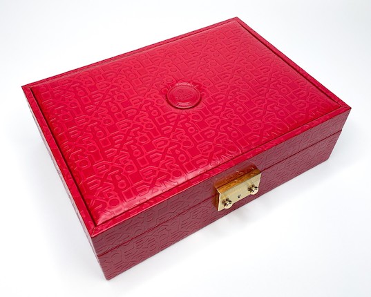 Bonhams Rolex. A Red Leatherette Box with key