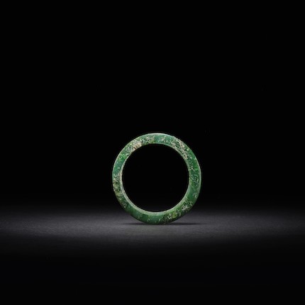 Bonhams : A GREEN JADE RING Shang Dynasty