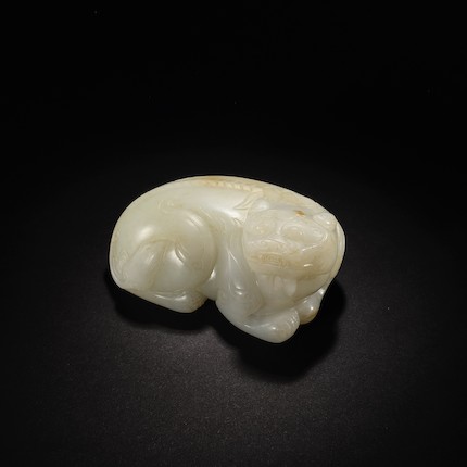 Bonhams : A PALE GREEN JADE CARVING OF A MYTHICAL BEAST Ming Dynasty