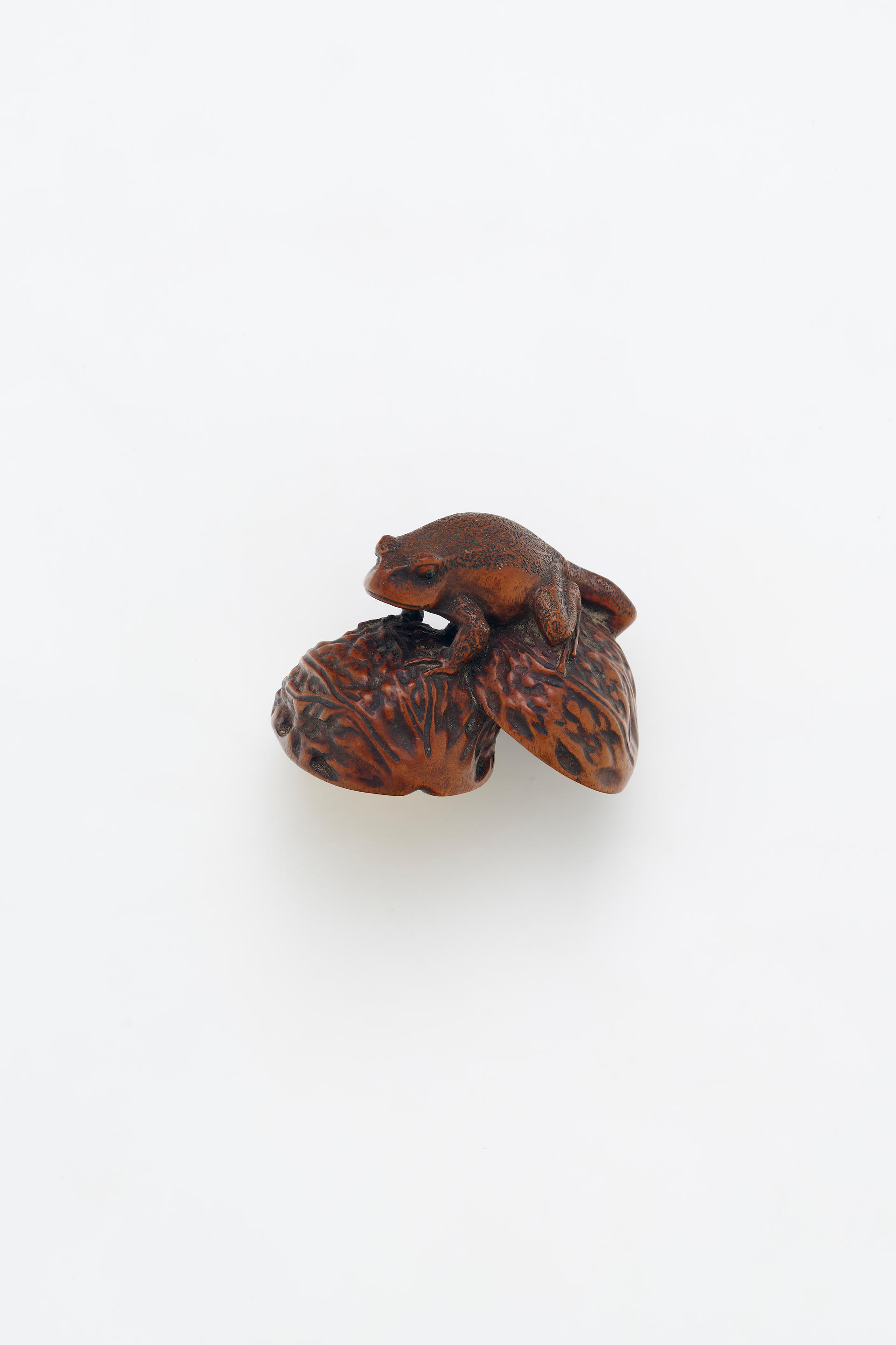 Bonhams : AN INLAID WOOD FROG AND WALNUT THEME NETSUKE Meiji Period ...